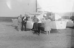 Photo of Family and dog inspecting Trinui